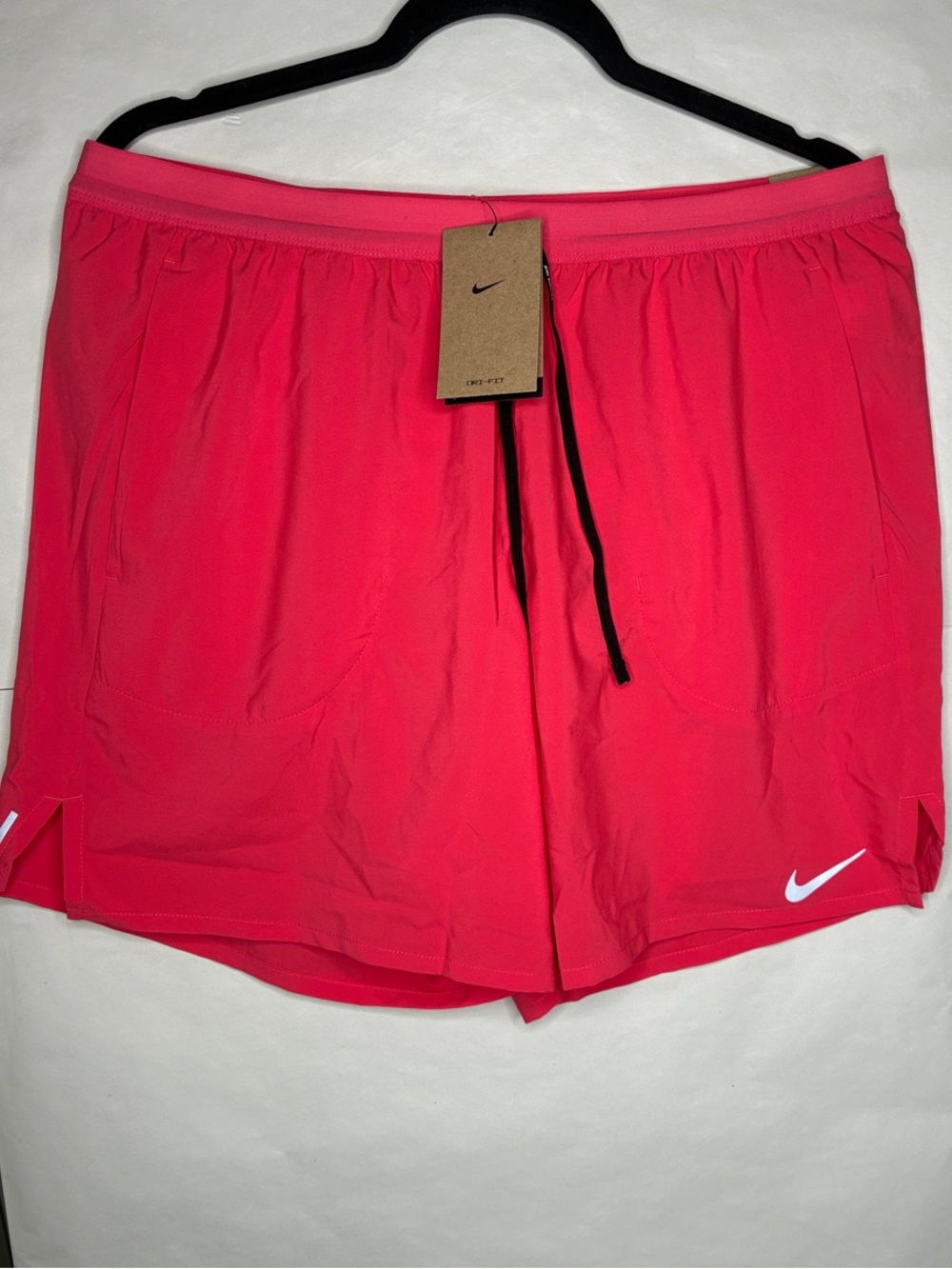 Nike Pink Athletic Shorts with White Swoosh and Black Drawstring